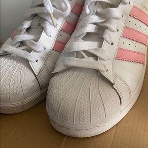 Worn white and pink adidas